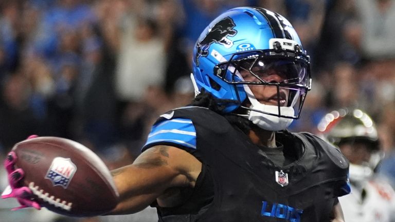 Detroit Lions running back Jammer Gibbs (0) celebrates his touchdown against the Tampa Bay Buccaneers during the second half of an NFL