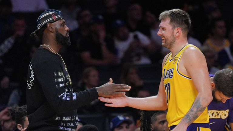 Luka Doncic is greeted by Lebron James during a preseason NBA game against the Sacramento Kings Oct. 17, 2025 (AP Photo/Jae C. Hong)