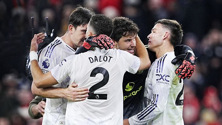 Manchester United celebrate their victory over Liverpool at Anfield