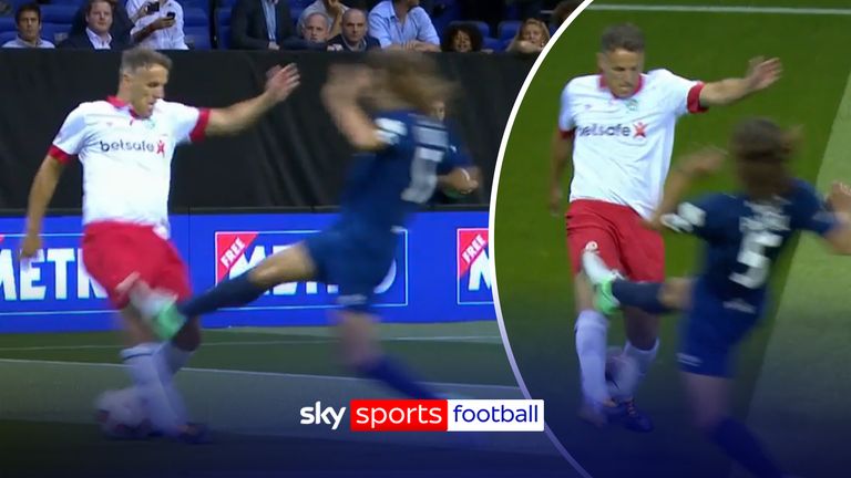 Puyol horror tackle on Neville