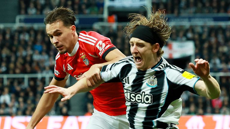 Newcastle's Anthony Gordon goes down under a challenge vs Benfica
