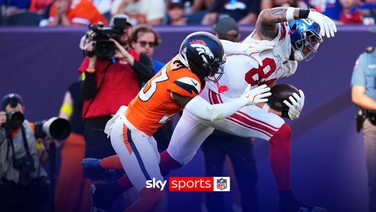 New York Giants tight end Theo Johnson, right, runs past Denver Broncos cornerback Jahdae Barron to score during the second half of an NFL football game in Denver, Sunday, Oct. 19, 2025. (AP Photo/Jack Dempsey)
