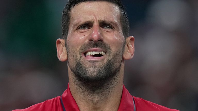 Novak Djokovic, of Serbia, reacts as he plays against Valentin Vacherot, of Monaco, during the men's singles semifinal match of the Shanghai Masters tennis tournament at Qizhong Forest Sports City Tennis Center, in Shanghai, China, Saturday, Oct. 11, 2025. (AP Photo/Andy Wong)