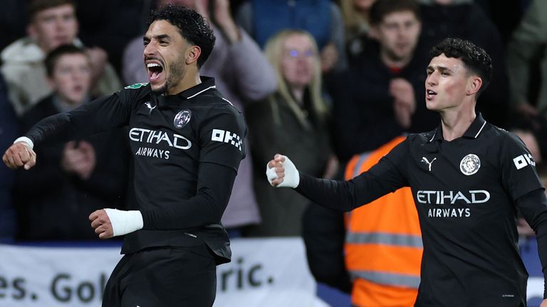 Omar Marmoush (left) celebrates with Phil Foden after putting Man City 2-1 ahead at Swansea