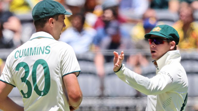 Australia's captain Pat Cummins, left, chats with teammate Steve Smith during play in the first cricket test between India and Australia