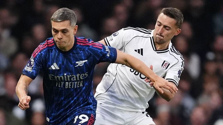 Leandro Trossard and Timothy Castagne battle for the ball 