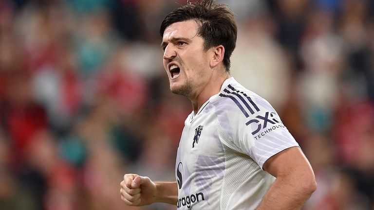 Harry Maguire celebrates after restoring Manchester United's lead at Anfield