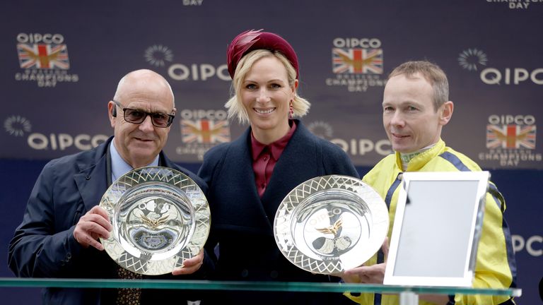 Richard Fahey (left) and Jamie Spencer (right) receive their awards after Powerful Glory's win