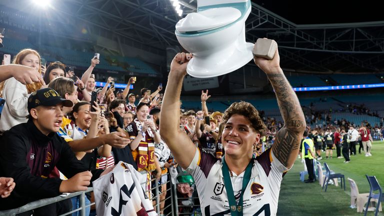Reece Walsh jokingly lifted a plastic toilet aloft after his side;s Grand Final win