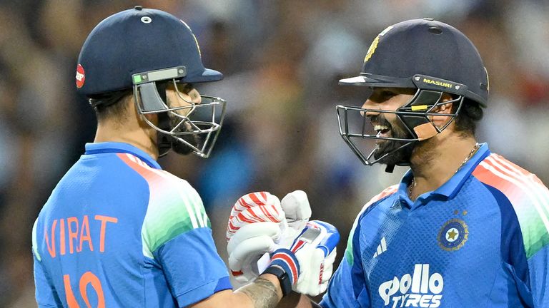 Rohit Sharma (right) and Virat Kohli celebrate their win over Australia in the third ODI at Sydney