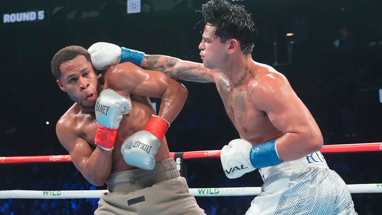 Ryan Garcia, right, punches Devin Haney of a super lightweight boxing match Sunday, April 21, 2024, in New York. Garcia won the fight. (AP Photo/Frank Franklin II)