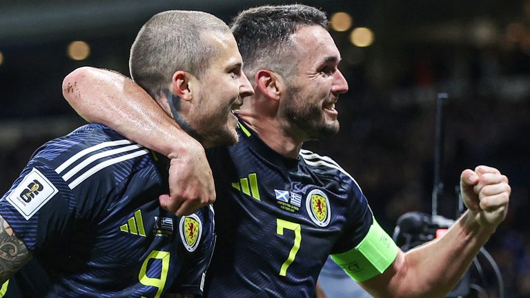 Lyndon Dykes (left) scores his 10th goal for Scotland and John McGinn earns his 80th international cap against Greece