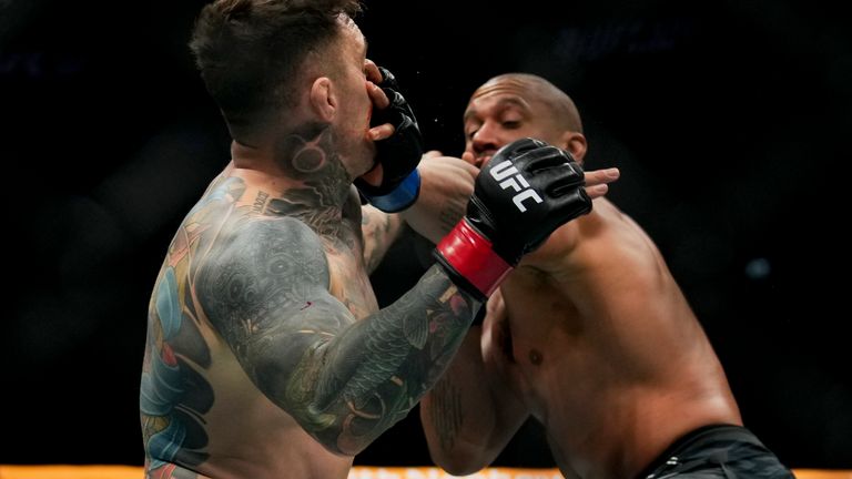 Ciryl Gane pokes the eye of Tom Aspinall during the heavyweight title bout