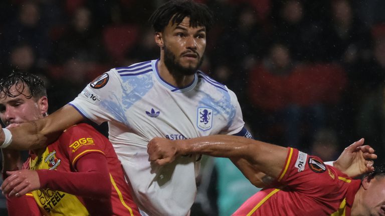 Aston Villa's Tyrone Mings pushes Go Ahead Eagles' Mats Deijl during the Europa League soccer match between Go Ahead Eagles and Aston Villa in Deventer, Netherlands, Thursday, Oct. 23, 2025. (AP Photo/Patrick Post)