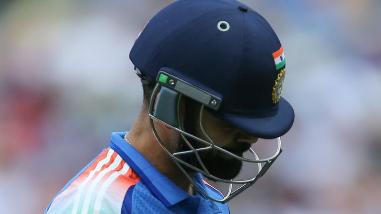 India's Virat Kohli walks off after being dismissed by Australia's Mitchell Starc during the one day international cricket