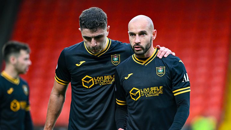 DUNDEE, SCOTLAND - OCTOBER 04: Livingston's Andy Winter (L) and Scott Pittman at full time during a William Hill Premiership match between Dundee United and Livingston at The CalForth Construction Arena, on October 04, 2025, in Dundee, Scotland.  (Photo by Paul Devlin / SNS Group)