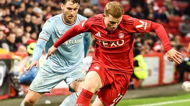 Aberdeen's Gavin Molloy tangles with Motherwell's Callum Slattery