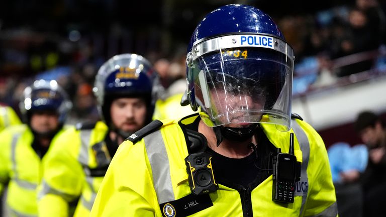 Police were struck by objects while away fans also threw punches at officers