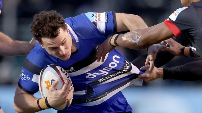 Bath's Finn Russell is tackled by Saracens' Noah Caluori