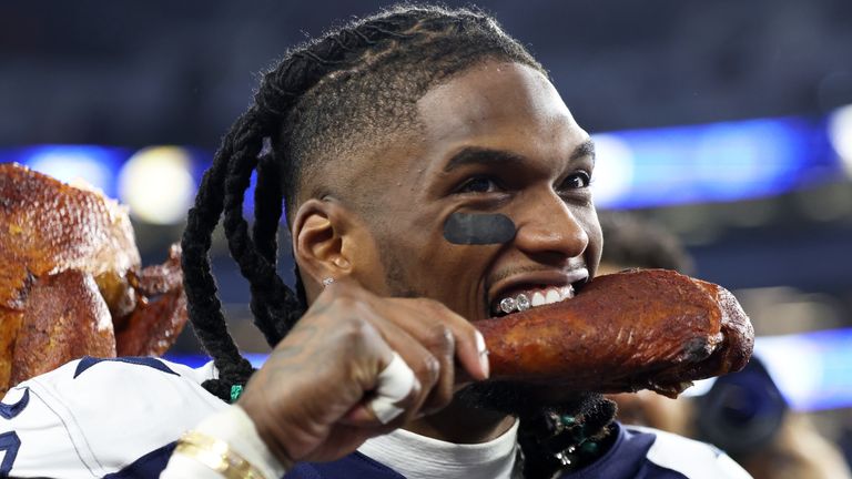 Dallas Cowboys wide receiver CeeDee Lamb celebrates with a turkey leg following an NFL football game against the Kansas City Chiefs Thursday, Nov. 27, 2025, in Arlington, Texas. (AP Photo/Gareth Patterson)