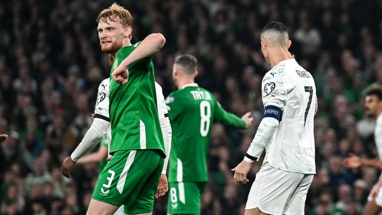 Liam Scales gestures and elbow action after Cristiano Ronaldo fouled Dara O'Shea during Portugal's match with Republic of Ireland