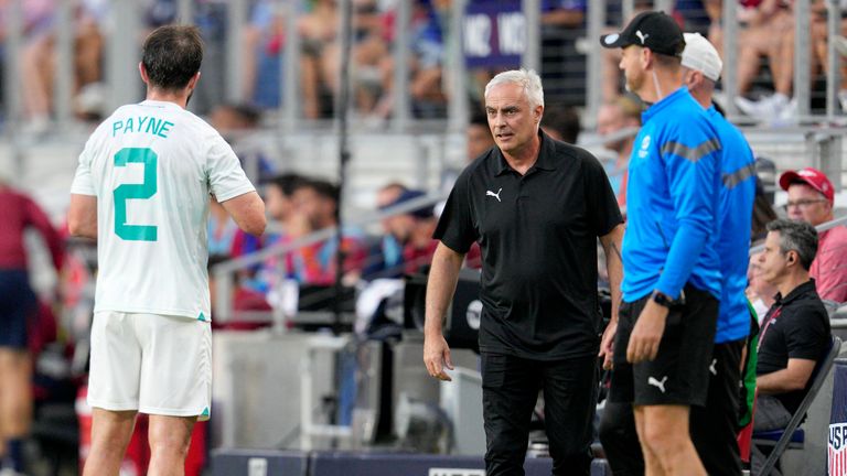 New Zealand head coach Darren Bazeley, center, speaks with Tim Payne (2) during the first half of a friendly soccer match against the United States, Tuesday, Sept. 10, 2024, in Cincinnati. (AP Photo/Jeff Dean)