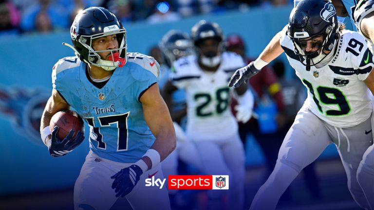 Tennessee Titans' Chimere Dike (17) runs back a punt for a touchdown as Seattle Seahawks' Jake Bobo (19) defends during the second half of an NFL football game Sunday, Nov. 23, 2025, in Nashville, Tenn. (AP Photo/John Amis)