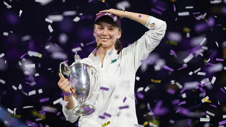 Elena Rybakina celebrates with the trophy after defeating Aryna Sabalenka in the WTA finals (AP Photo/ Fatima Shbair)