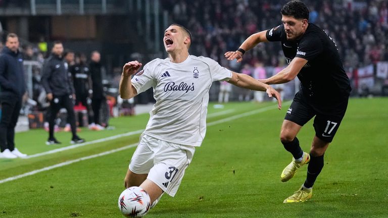 Nottingham Forest's Nikola Milenkovic, left, is tackled down by Sturm's Emir Karic during their Europa League match