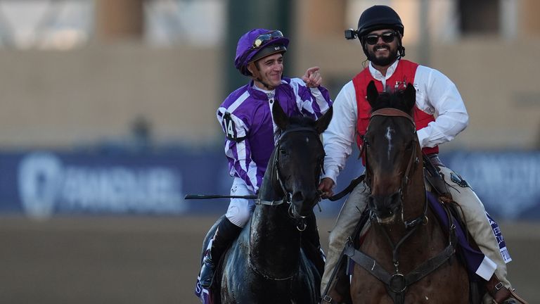 Christophe Soumillon reacts after riding Gstaad, left, to victory in the Breeders' Cup Juvenile Turf (AP Photo/Gregory Bull)