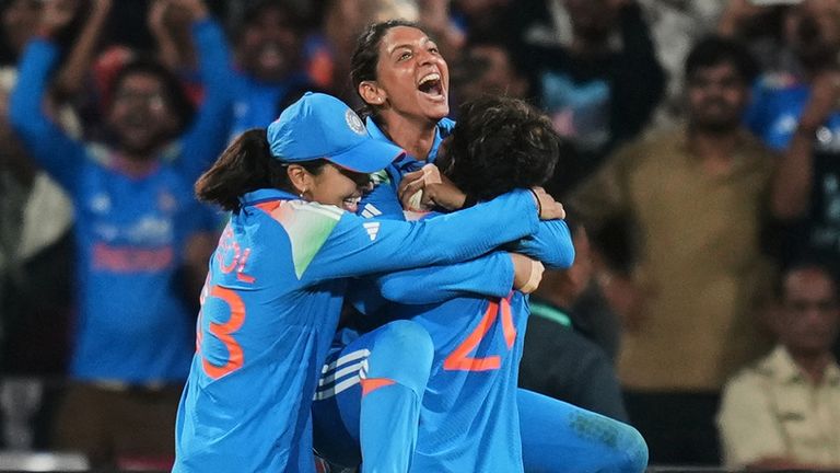 India's captain Harmanpreet Kaur, center, celebrates with teammates after winning the ICC Women's Cricket World Cup final match against South Africa in Navi Mumbai, India, Sunday, Nov. 2, 2025. (AP Photo/Rafiq Maqbool)