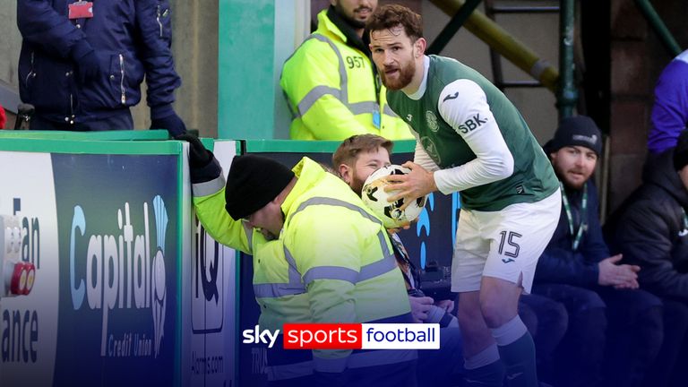 Hibernian's Jack Iredale (right) wipes the ball on the back of a steward before the throw-in during a William Hill Premiership match at Easter Road in Edinburgh. Photo date: Sunday, November 30, 2025.