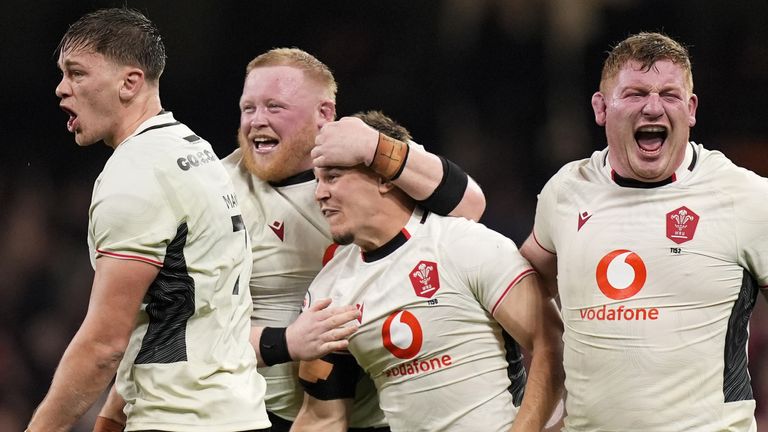 Jarrod Evans celebrates with his Wales team-mates after the final whistle of their Quilter Nations Series match against Japan that he won with the game's final kick
