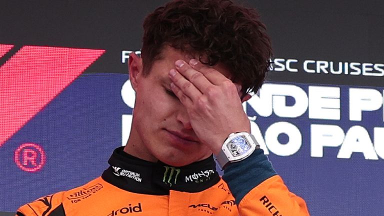 McLaren driver Lando Norris of Britain reacts during the podium ceremony after winning the Brazilian Formula One Grand Prix at the Interlagos race track, in Sao Paulo, Sunday, Nov. 9, 2025. (AP Photo/Ettore Chiereguini)