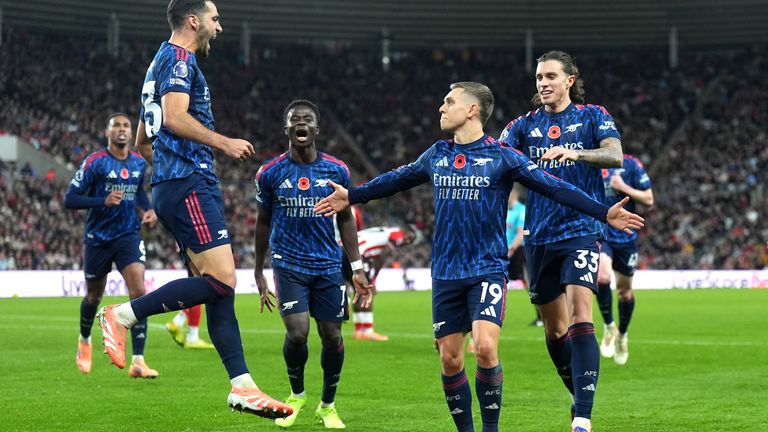 Leandro Trossard (centre) celebrates with team-mates after scoring Arsenal's second goal