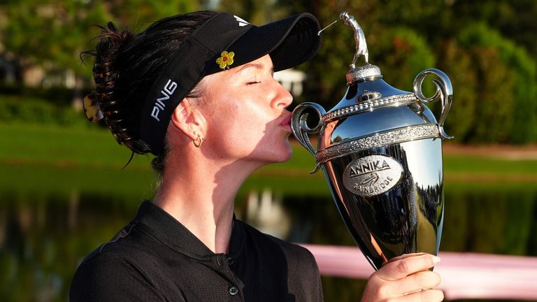 LPGA player Linn Grant kisses the trophy after winning The Annika driven by Gainbridge at Pelican