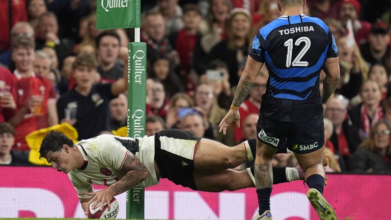 Louis Rees-Zammit scores a try during the Quilter Nations Series match at Cardiff's Principality Stadium