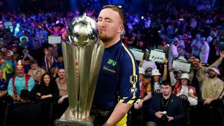 Luke Littler kisses The Sid Waddell Trophy after winning the Paddy Power World Darts Championship final against Michael van Gerwen (not pict