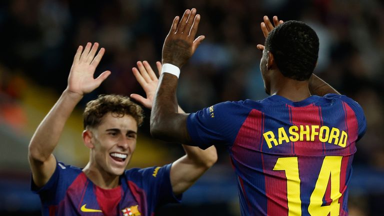 Barcelona's Marcus Rashford, right, celebrates with his teammate Fermin Lopez after scoring his side's third goal during a Spanish La Liga soccer match between FC Barcelona and Elche CF in Barcelona, Spain, Sunday, Nov. 2, 2025. (AP Photo/Joan Monfort)