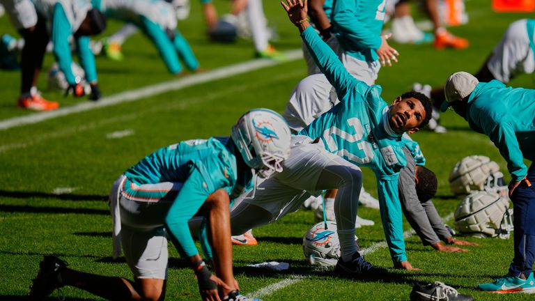 Miami Dolphins players warm-up at Atletico Madrid's Metropolitano Stadium