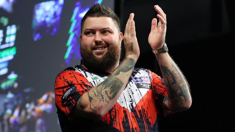 Michael Smith's place in the last 16 was secured after Luke Humphries' victory over Nathan Aspinall
