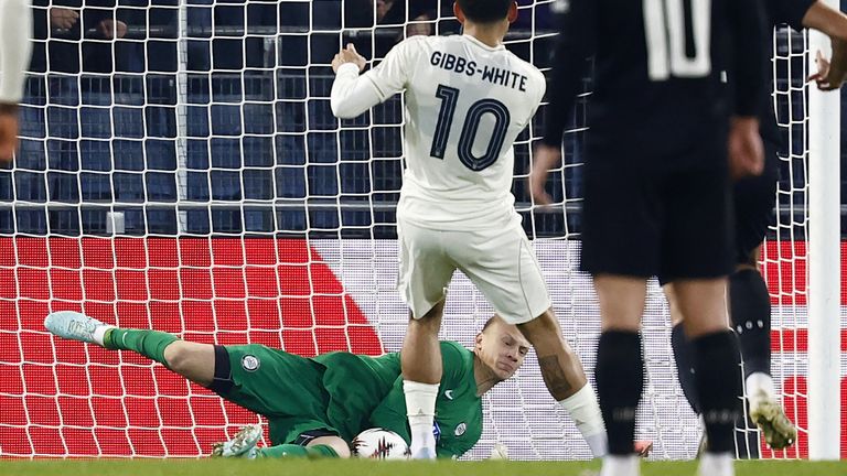 Sturm Graz's Danish goalkeeper Oliver Christensen saves from Morgan Gibbs-White 