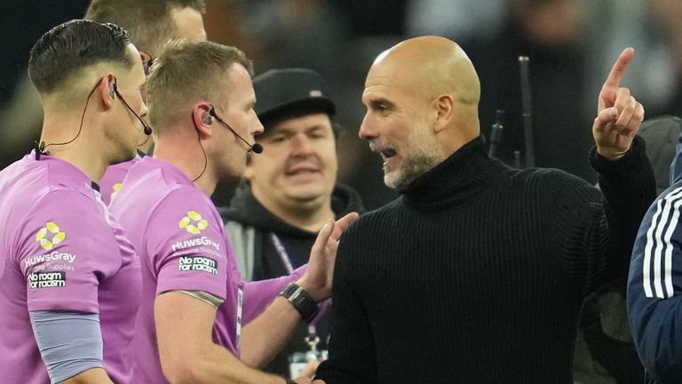 Pep Guardiola with referee Sam Barrott and his assistants at full time (AP Photo/Jon Super)