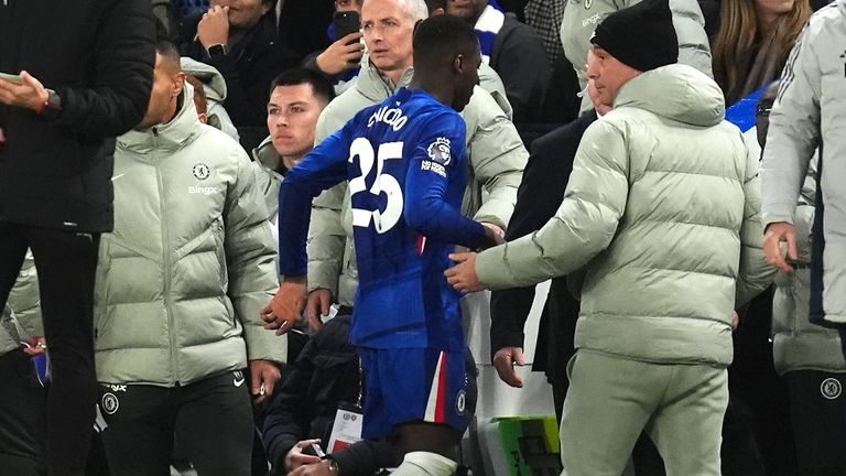 Moises Caicedo walks down the tunnel after being sent off for a challenge on Mikel Merino