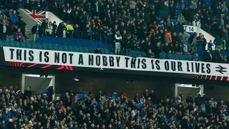 Rangers fans unfurl banners against the board