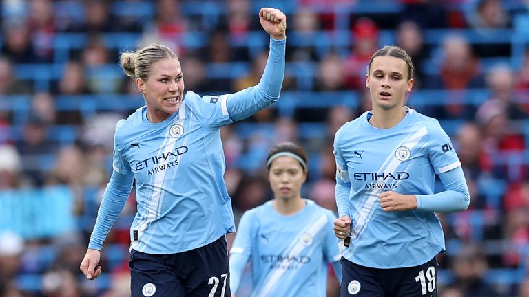 Rebecca Knaak celebrates after leading Manchester City against Manchester United