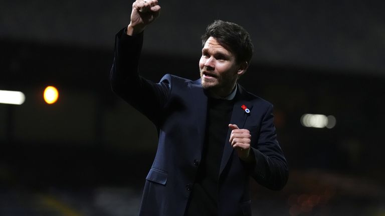 Danny Rohl celebrates on the pitch after Rangers 3-0 win vs Dundee