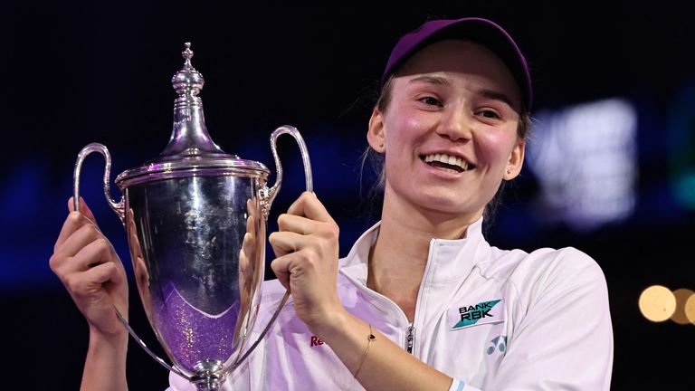 Kazakhstan's Elena Rybakina lifts the trophy after defeating Belarus' Aryna Sabalenka in the WTA Finals