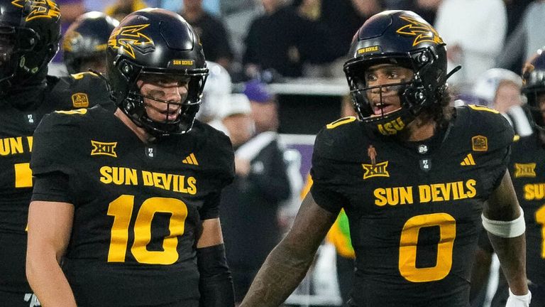 Arizona State Sun Devils quarterback Sam Leavitt (10) and wide receiver Jordyn Tyson (0) lead th Sun Devils during a NCAA college football game against TCU Horned Frogs Friday, Sept. 26, 2025, in Tempe, Ariz. (AP Photo/Darryl Webb)