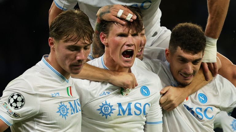 Napoli's Scott McTominay, second left, celebrates scoring with teammates during the Champions League opening phase soccer match between Napoli and Qarabag in Naples, Italy, Tuesday Nov. 25, 2025. (Alessandro Garofalo/LaPresse via AP)